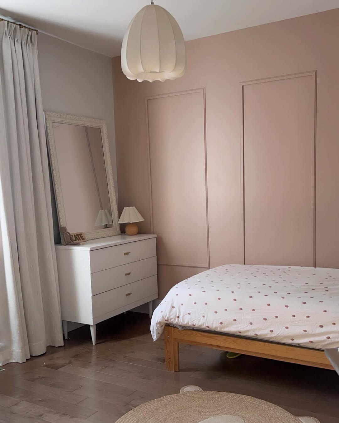 Pale Pink Wall Paneling Creates a Soft Backdrop