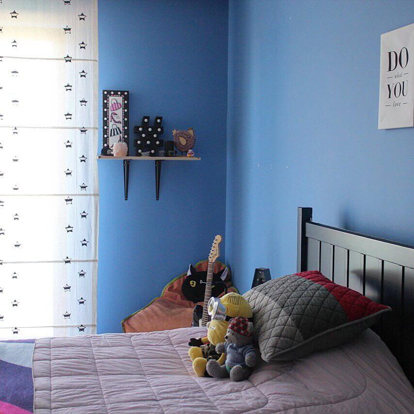 Poster With Simple Text Anchors a Bright Blue Wall