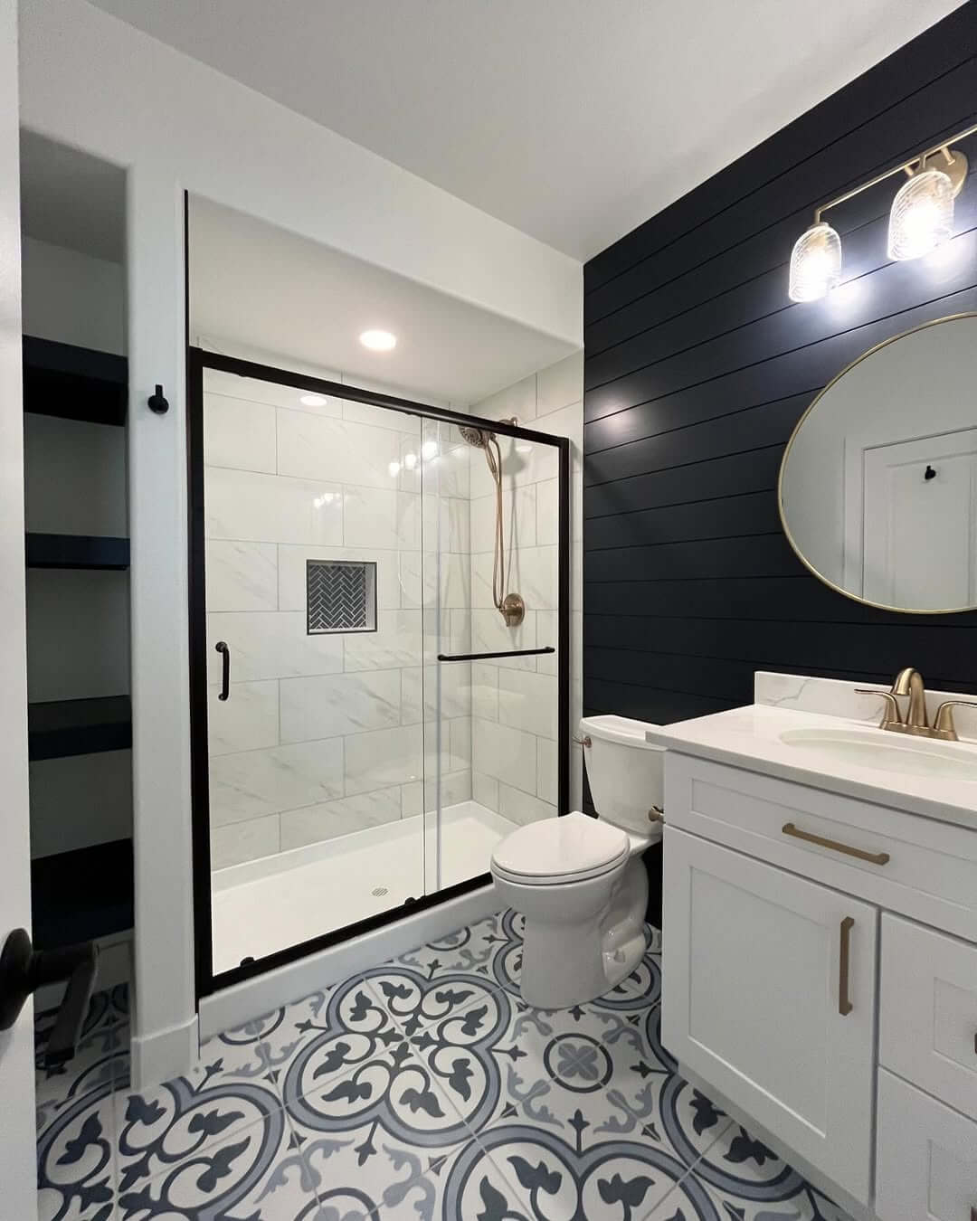 Bold Patterned Floor Tiles Anchor a Modern Bathroom