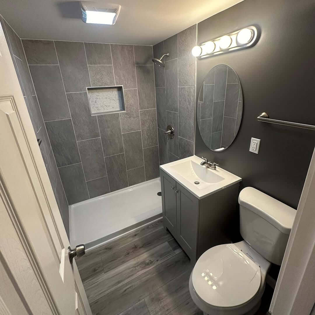 Gray Subway Tile Walls Create a Sleek Shower Enclosure