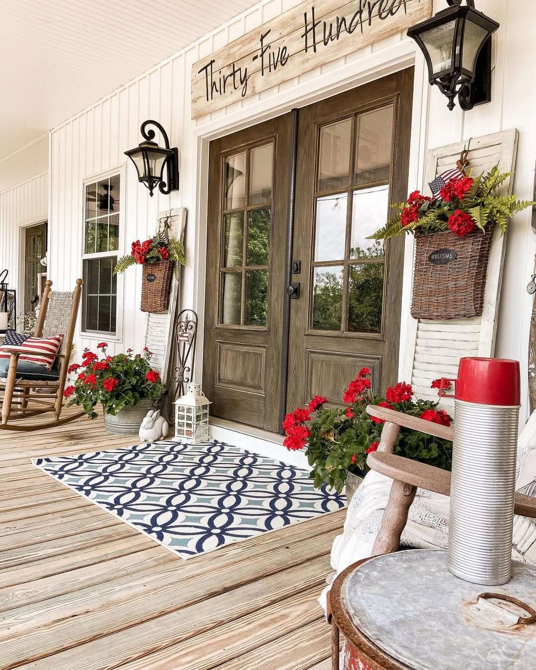 Woven Baskets Add Vertical Greenery and Red Flowers to Shutters