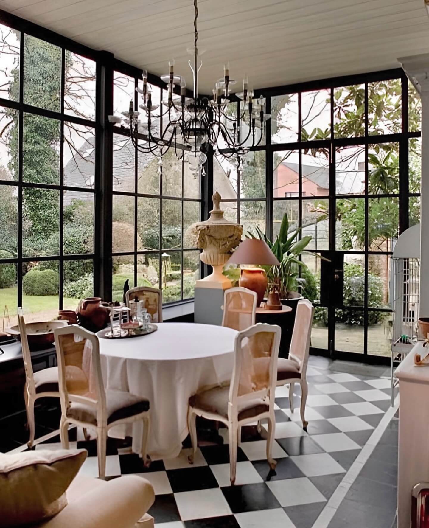 Dramatic Chandelier Adds Old-World Glamour Above Dining