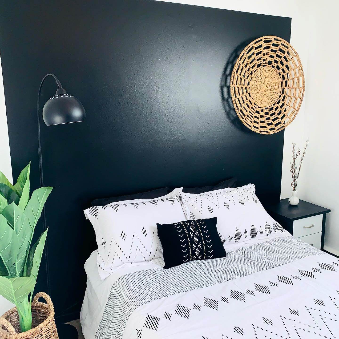 Woven Wall Basket Adds Natural Texture Above Bed