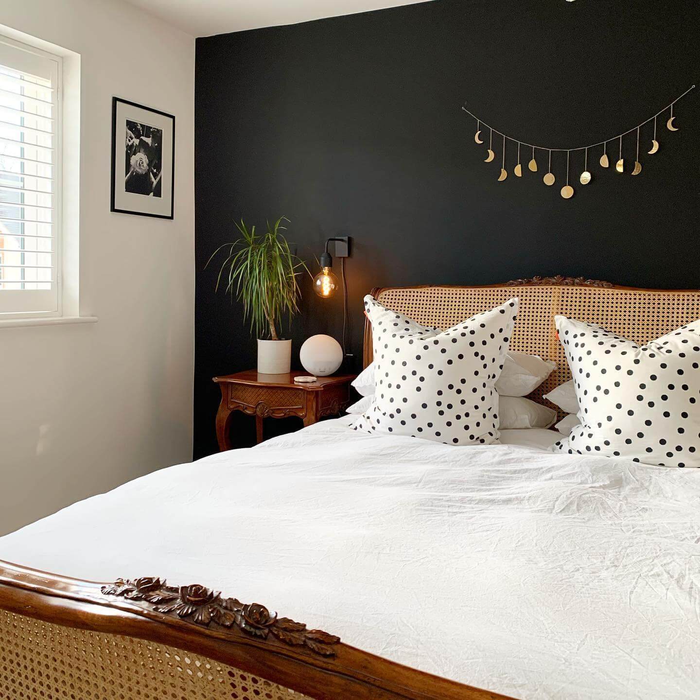 Moon Phase Garland Adds Celestial Charm Above the Bed