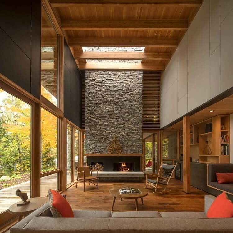 Stone fireplace with wood accents creates a cozy focal point
