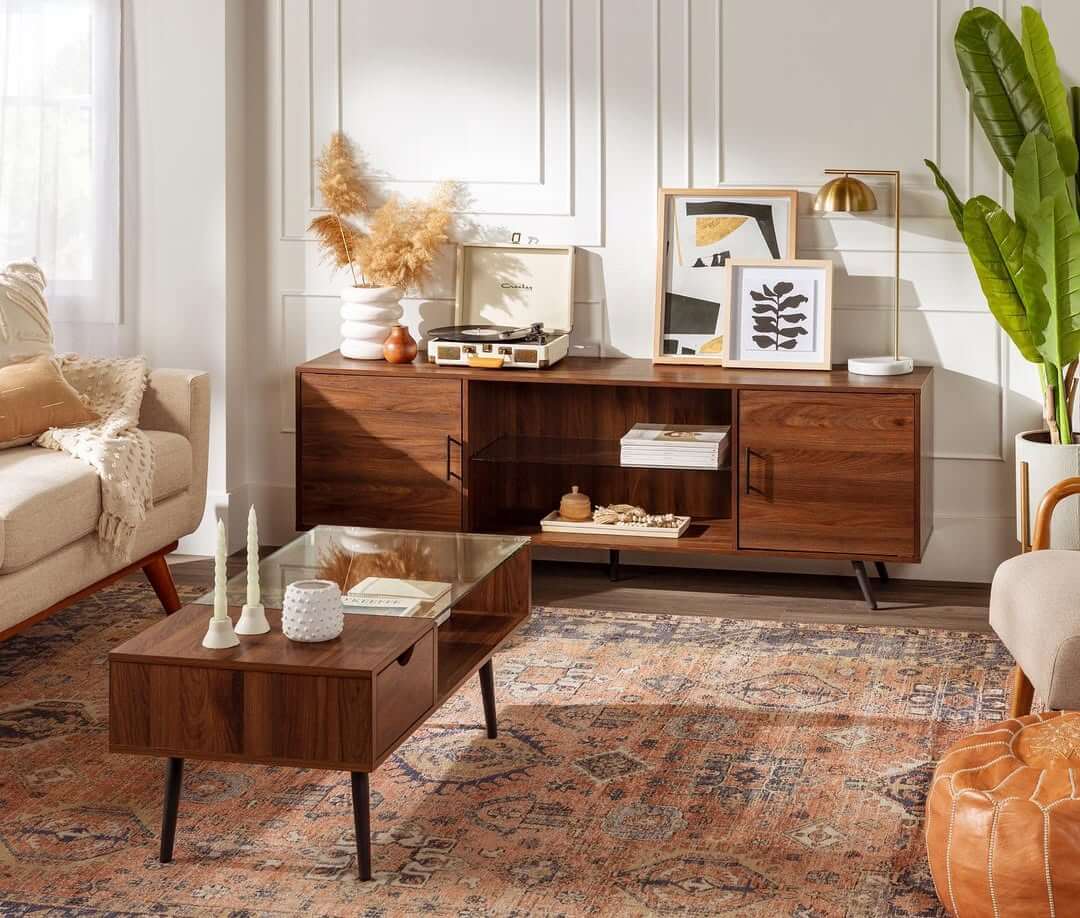 Layer Art and a Brass Lamp on a Media Console