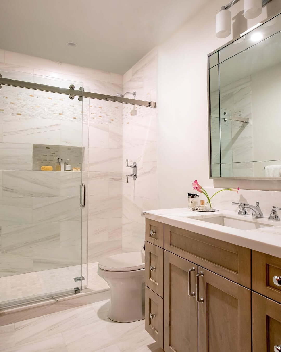 Recessed Shower Niche Holds Toiletries Within Marble Tile