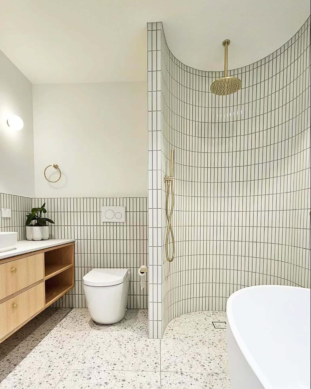 Curved Shower Wall Lined With Vertical Kit Kat Tiles