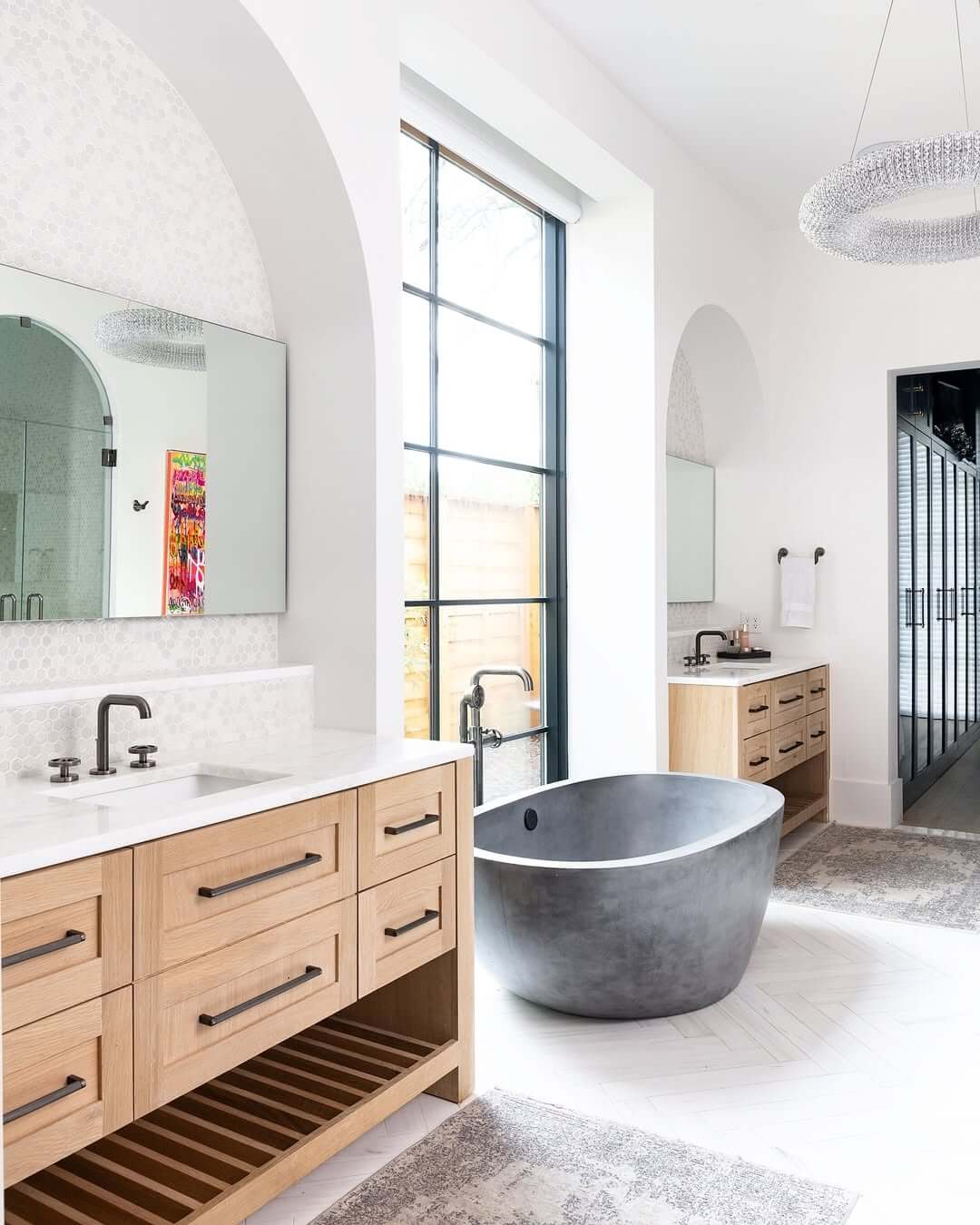 Matte Concrete Tub Anchors a White Bathroom's Serene Palette