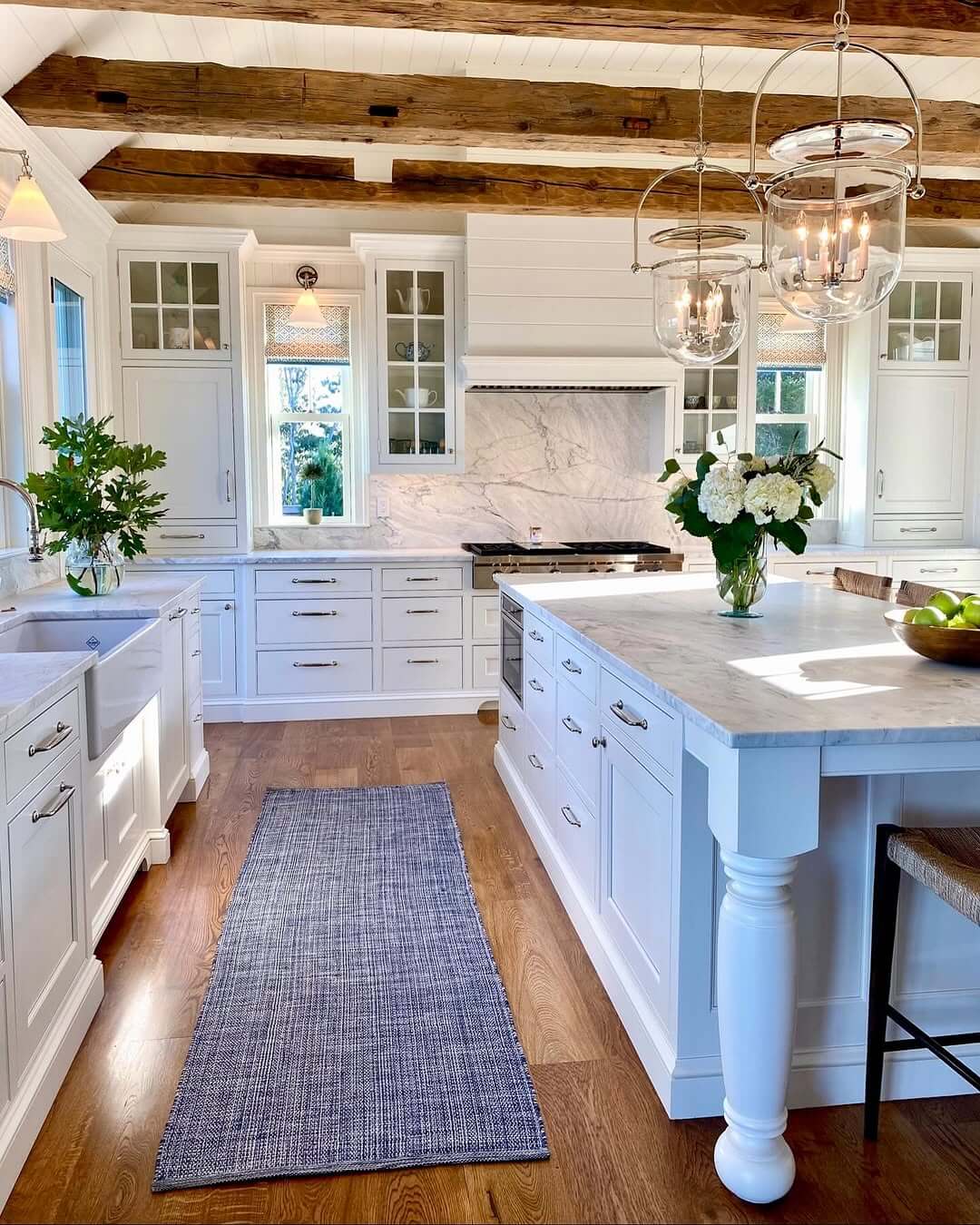 Glass Bell Jar Lanterns Illuminate the Kitchen Island