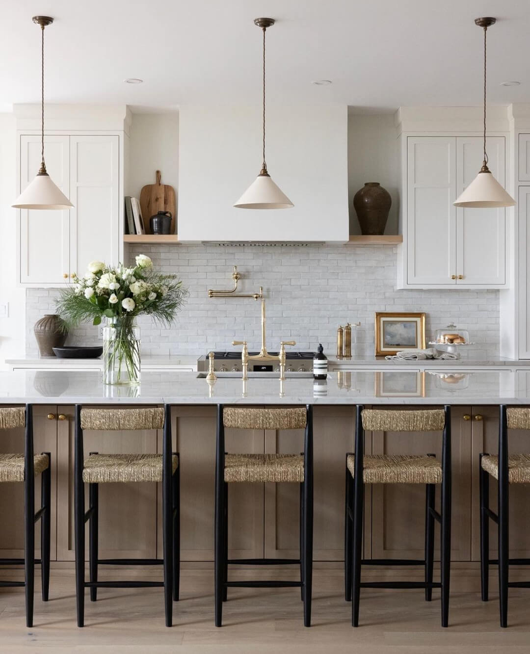 Neutral Toned Island Cabinets Complement White Kitchen Palette