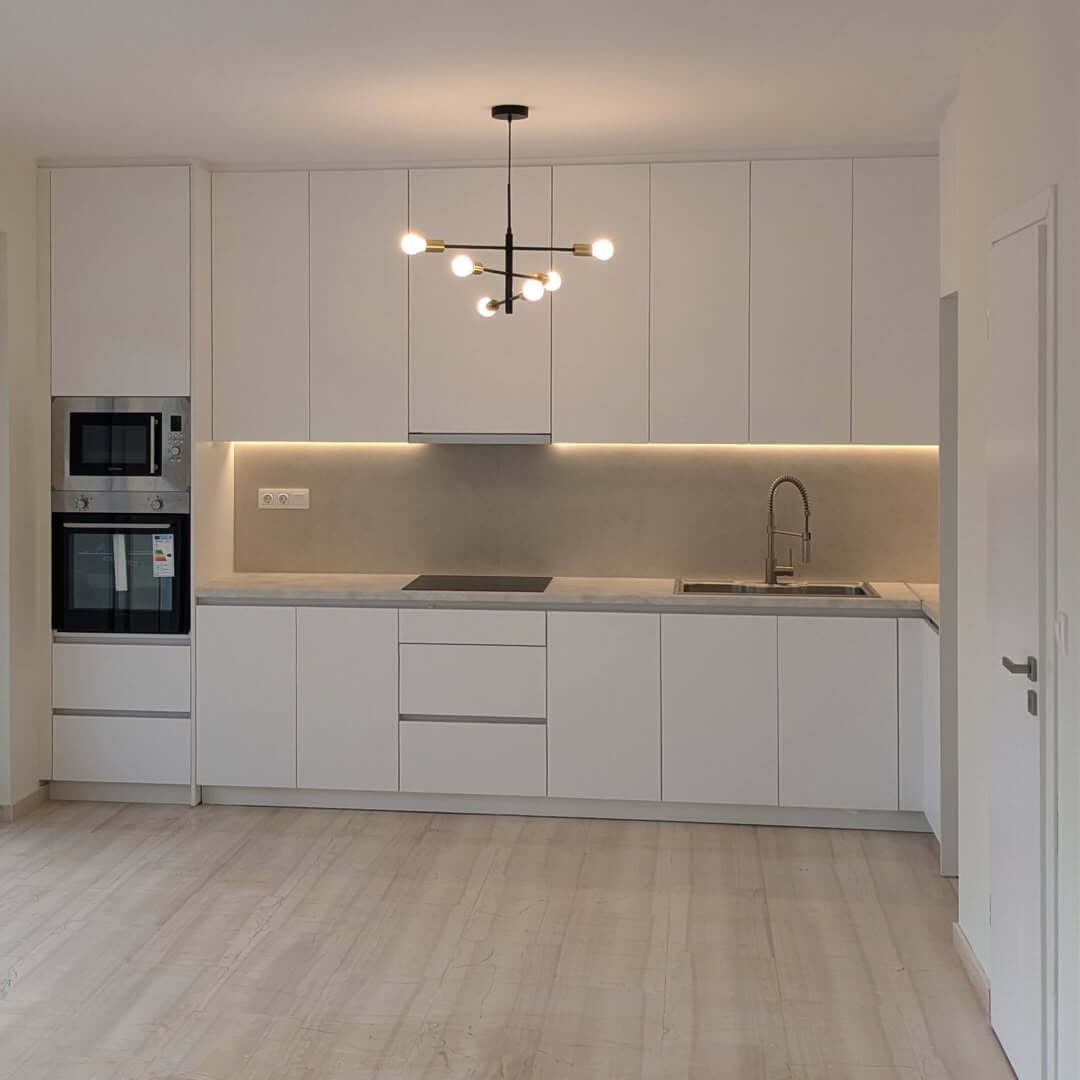 Modern Chandelier Adds a Sculptural Element Above the Island