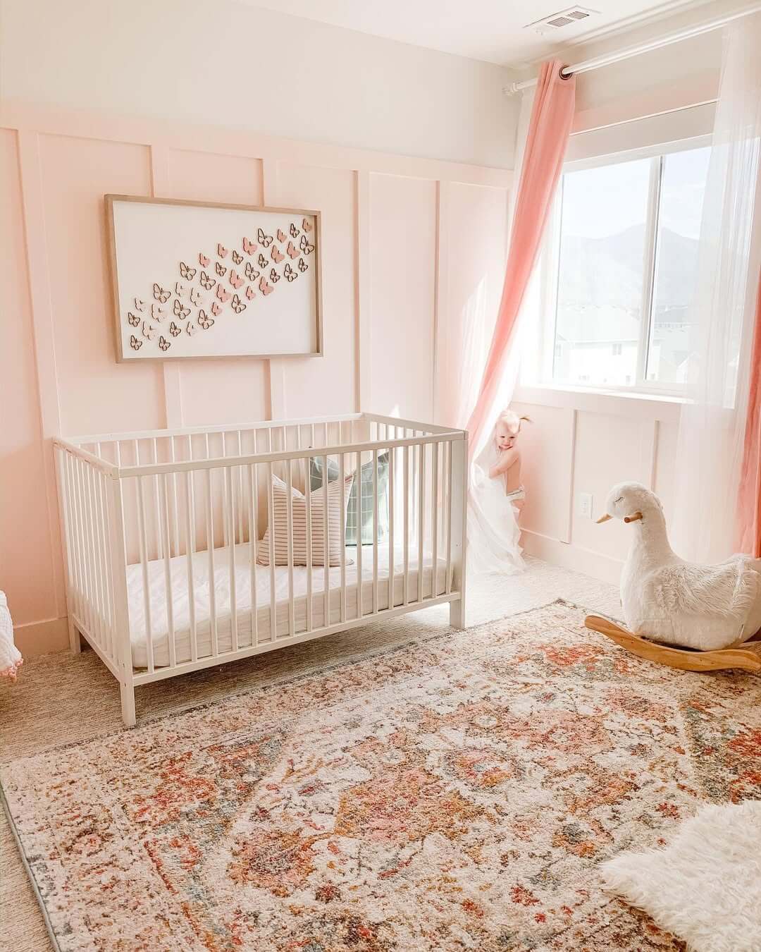 Framed Butterfly Art Adds Whimsical Detail Above the Crib
