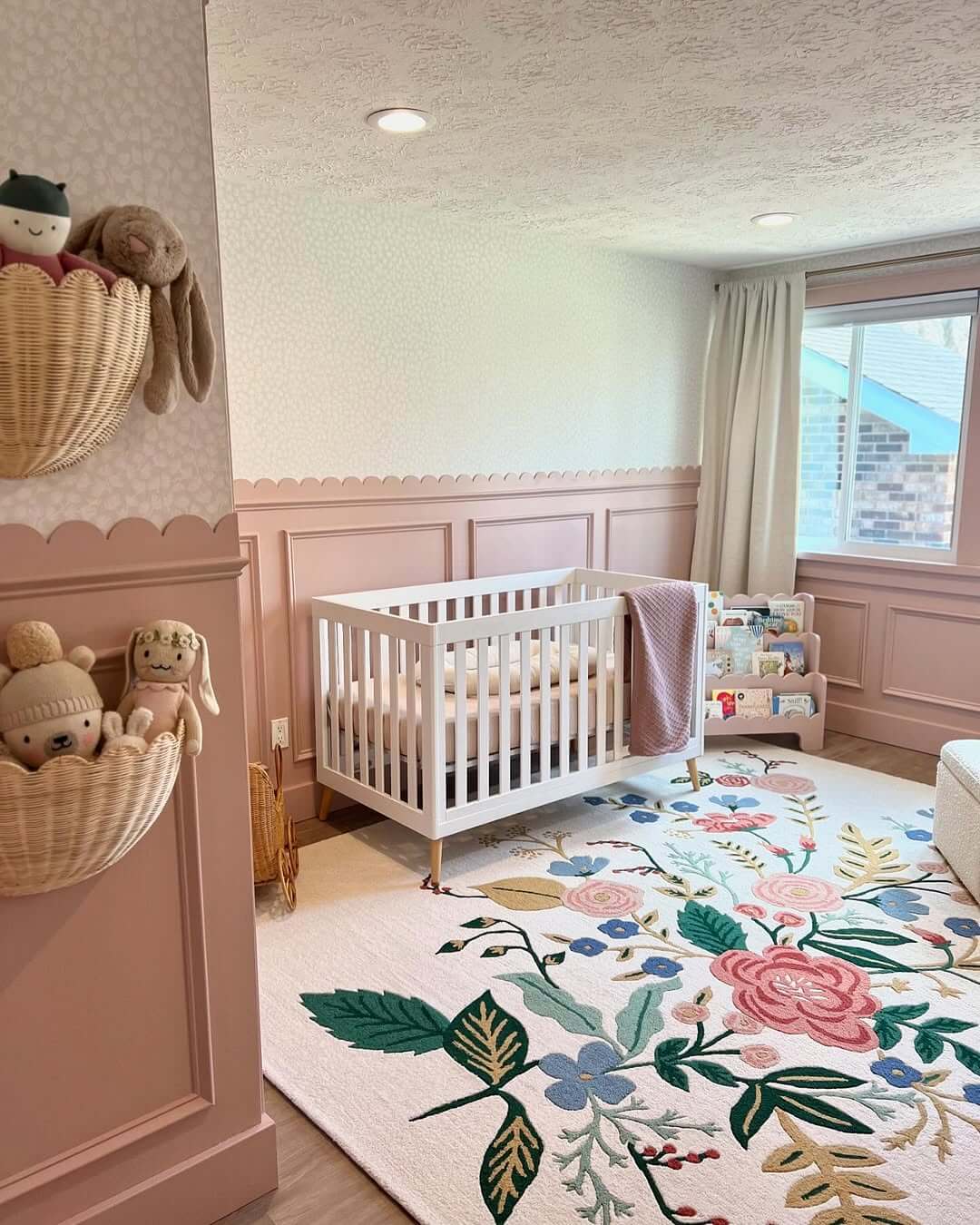 Woven Baskets Hold Plush Toys on Scalloped Pink Walls