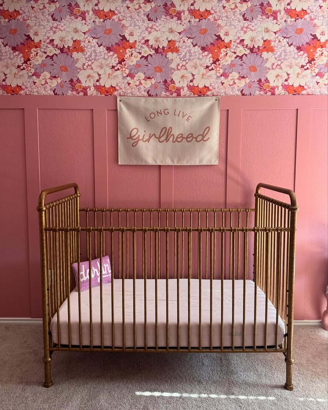 Bold Floral Wallpaper and Pink Paneling Create a Playful Backdrop