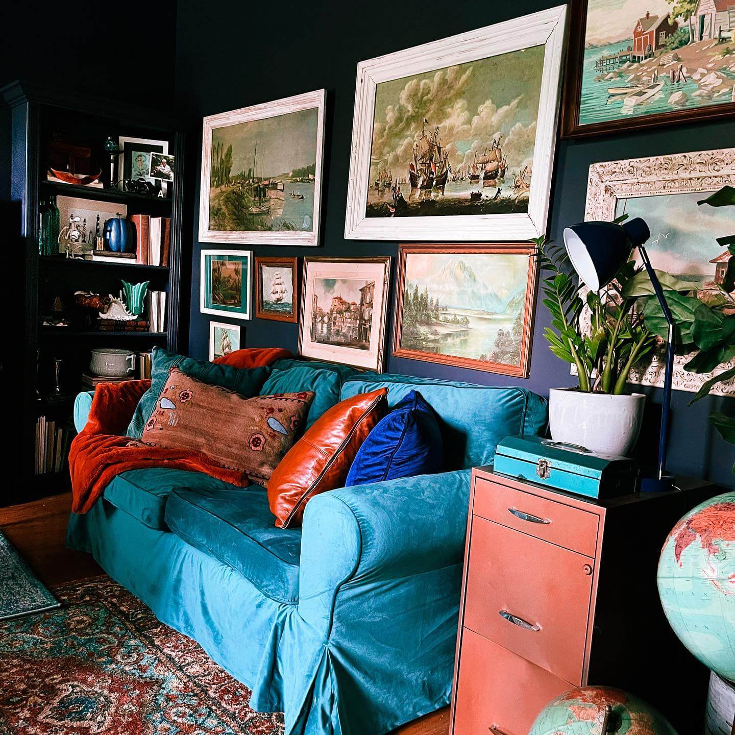 Landscapes and Seascapes to Frame a Cozy Teal Sofa