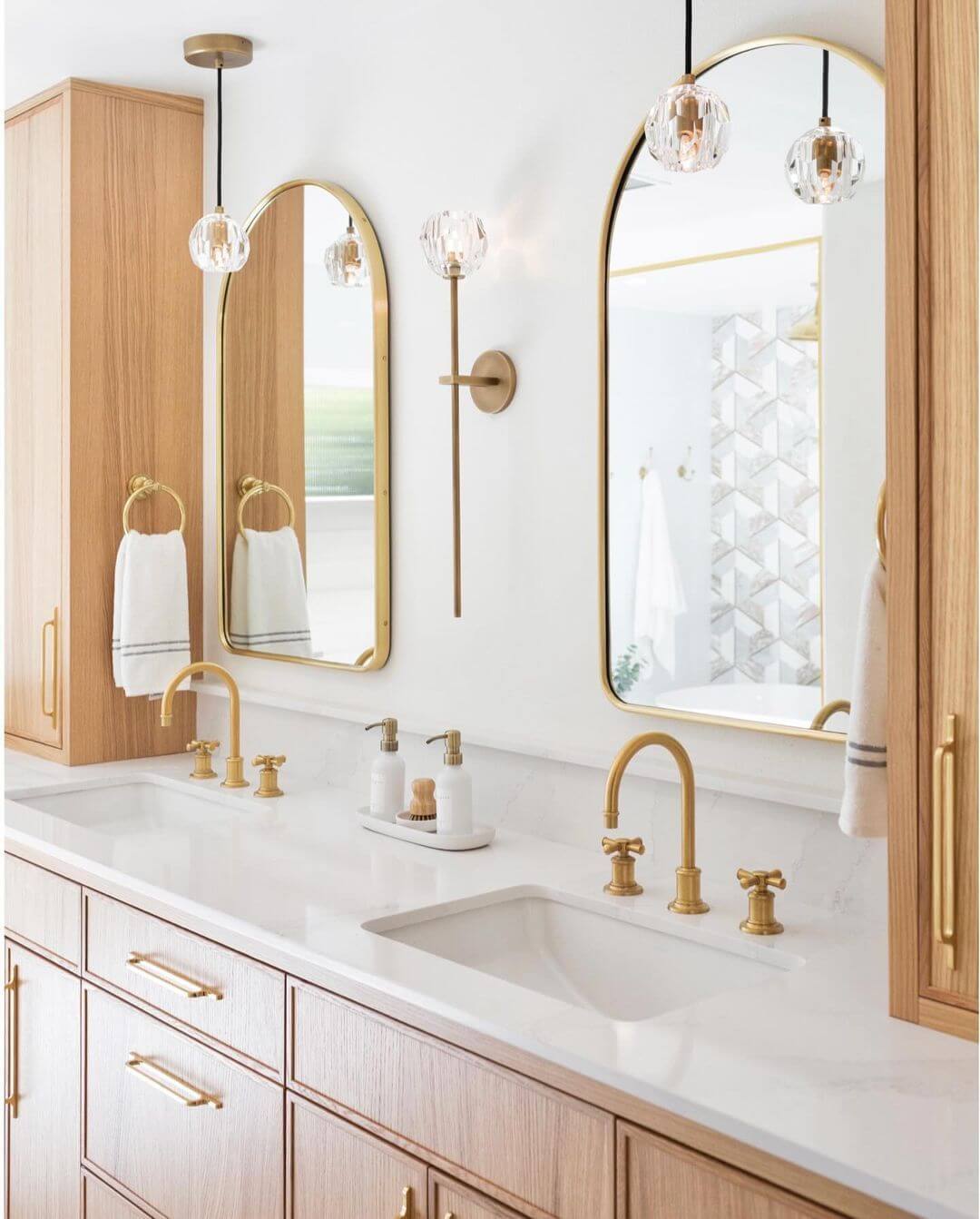 Arched Gold-Framed Mirrors Add Height to White Vanity