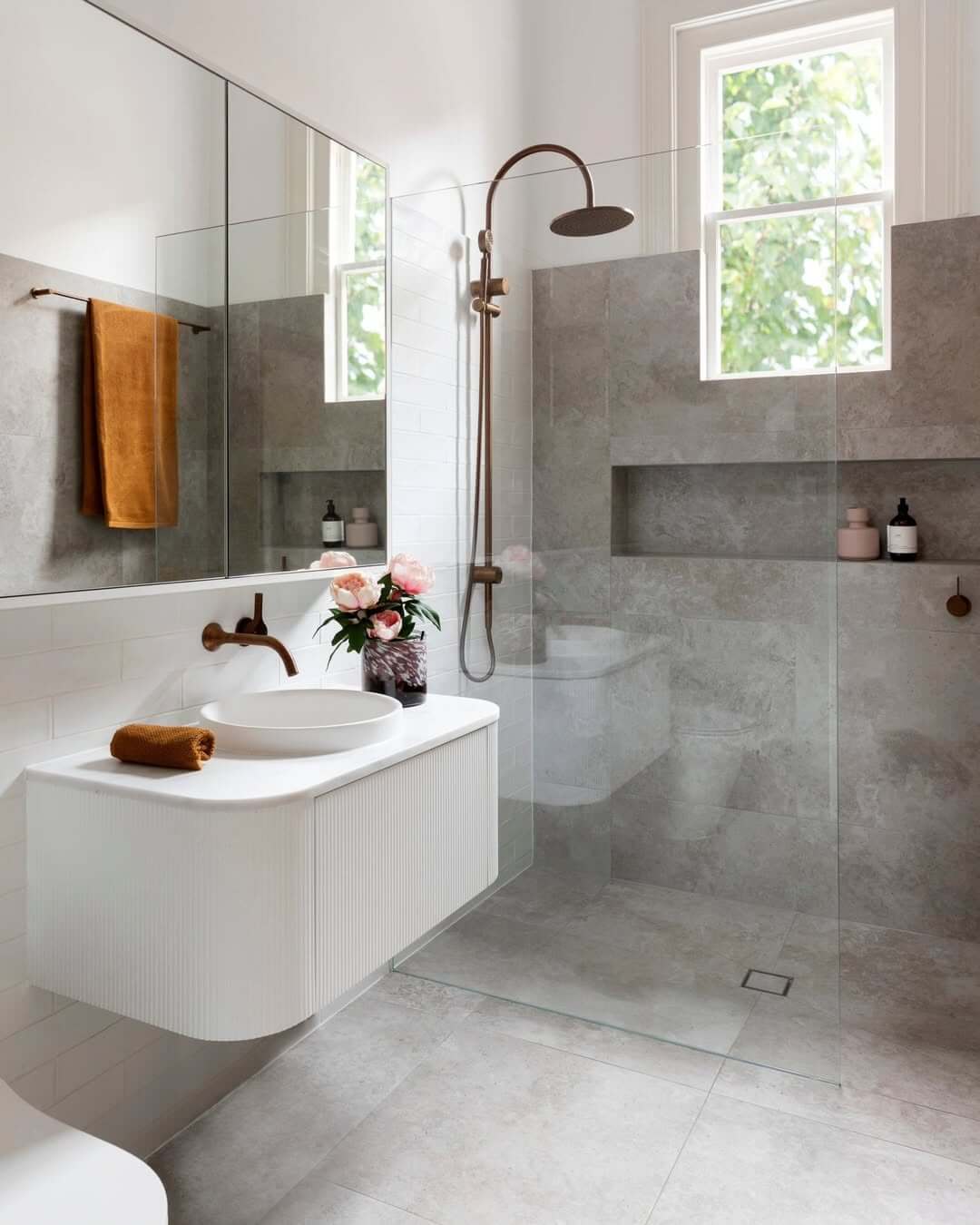 Fluted Vanity Adds Soft Texture to White Bathroom